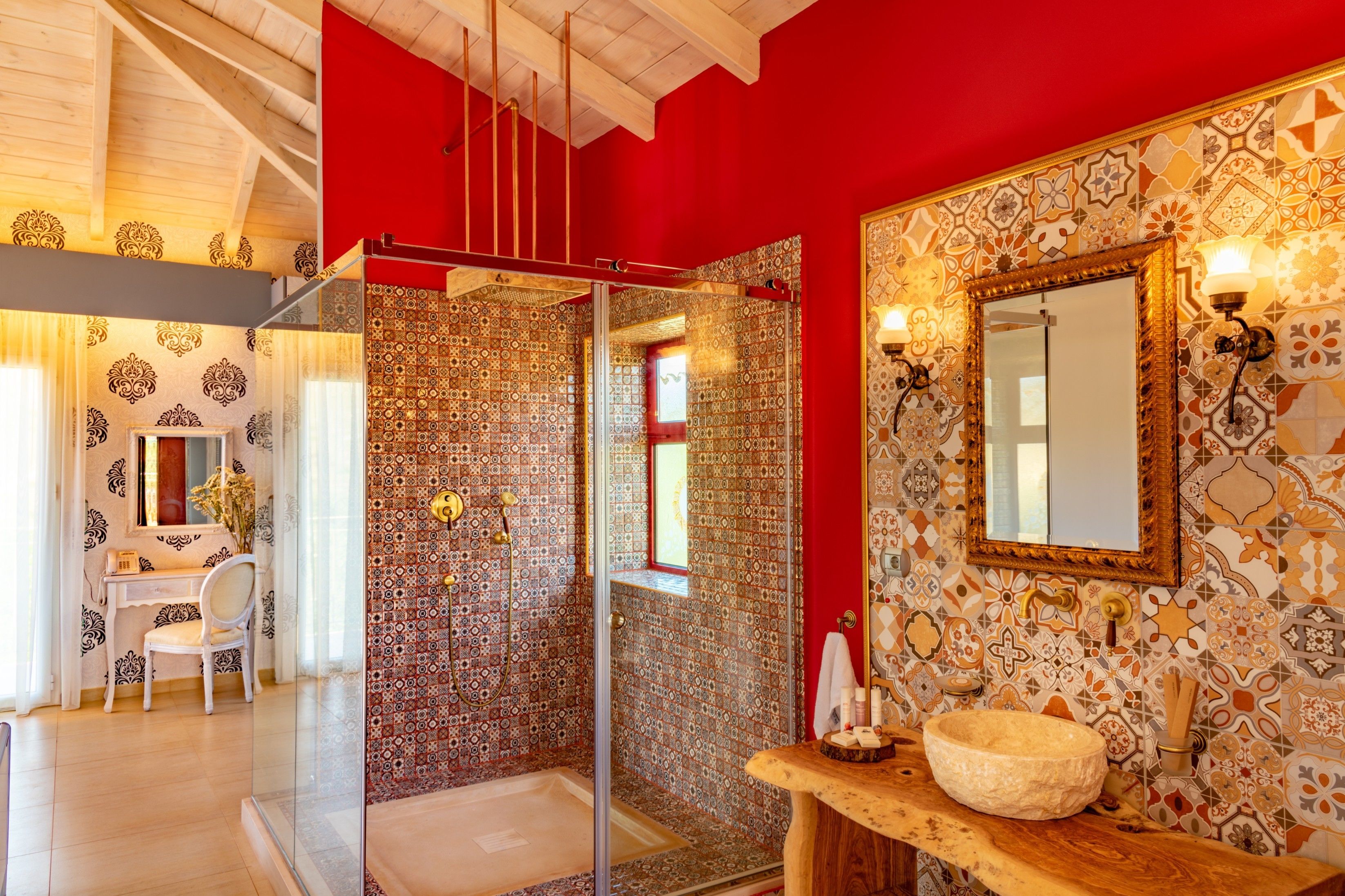 A bathroom with a shower, a sink, and a mirror.
