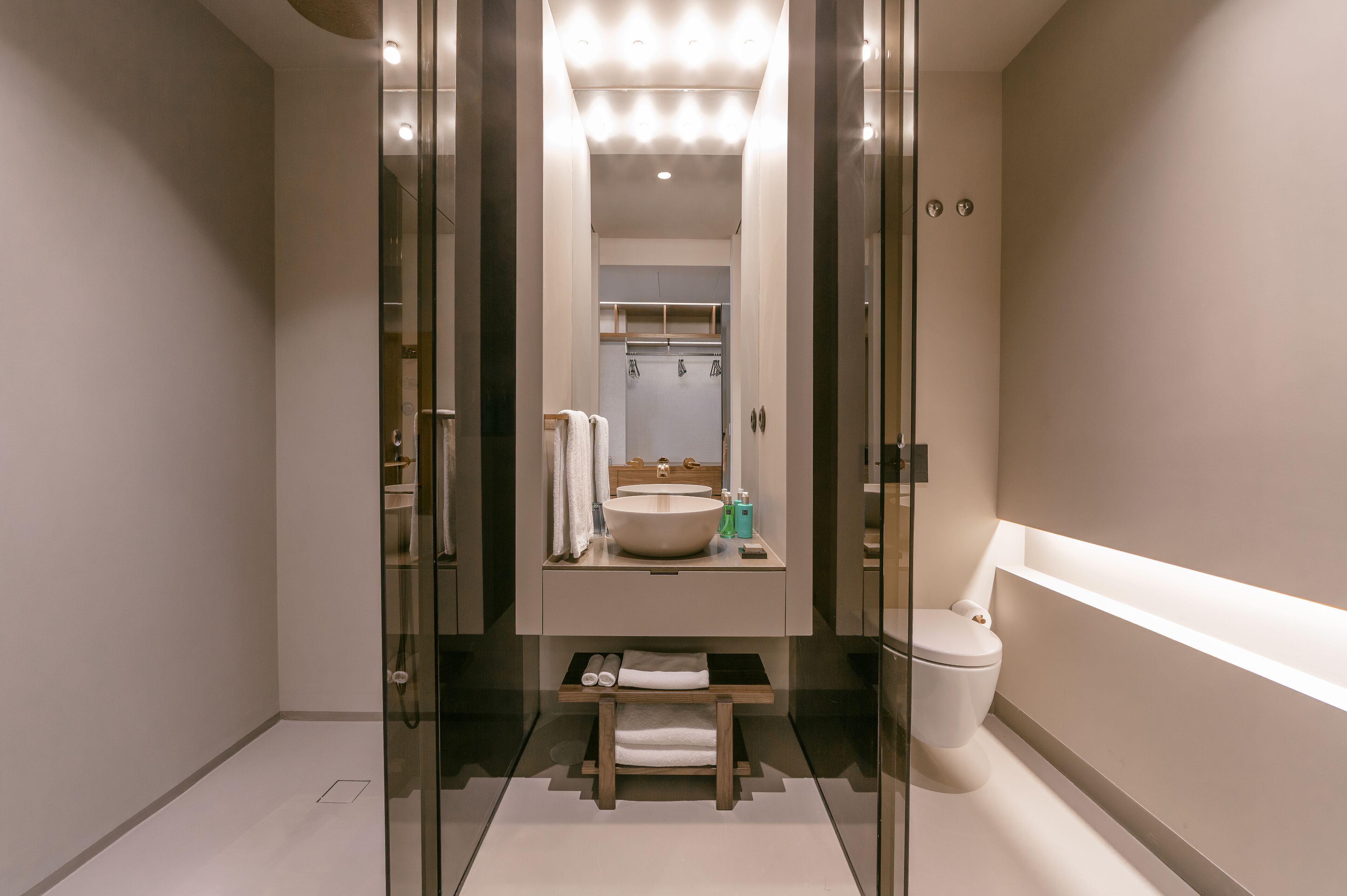 designer toiletries, hair dryer, towels