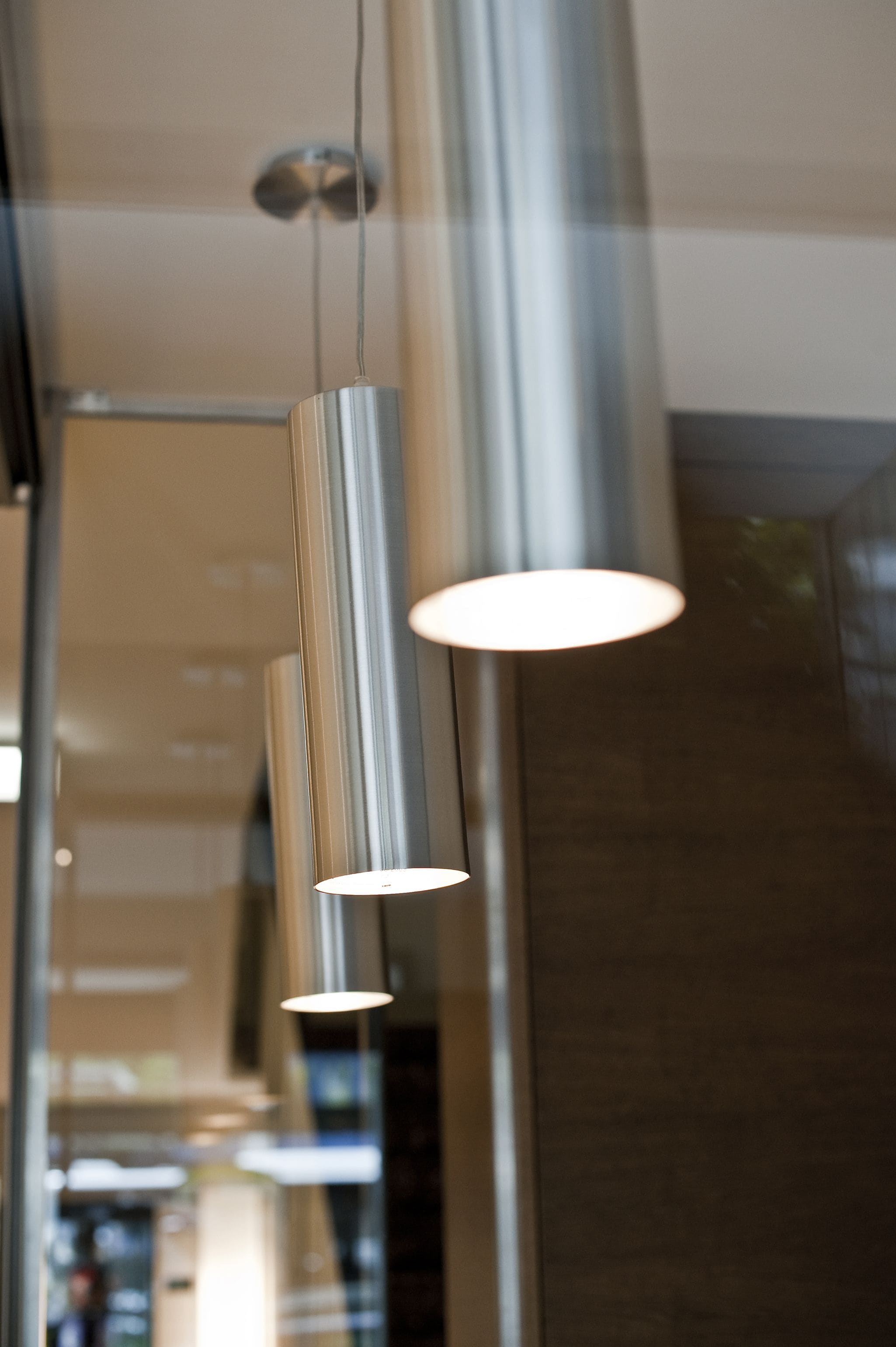 A modern interior with a series of hanging pendant lights.