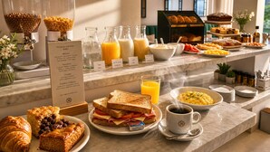 A breakfast buffet with various food options, including cereals, juices, and pastries. - Duque Hotel Boutique & Spa (Buenos Aires)