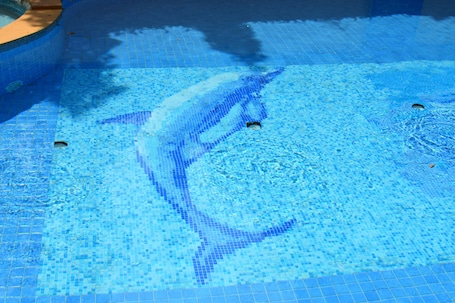 Outdoor pool, pool umbrellas, sun loungers