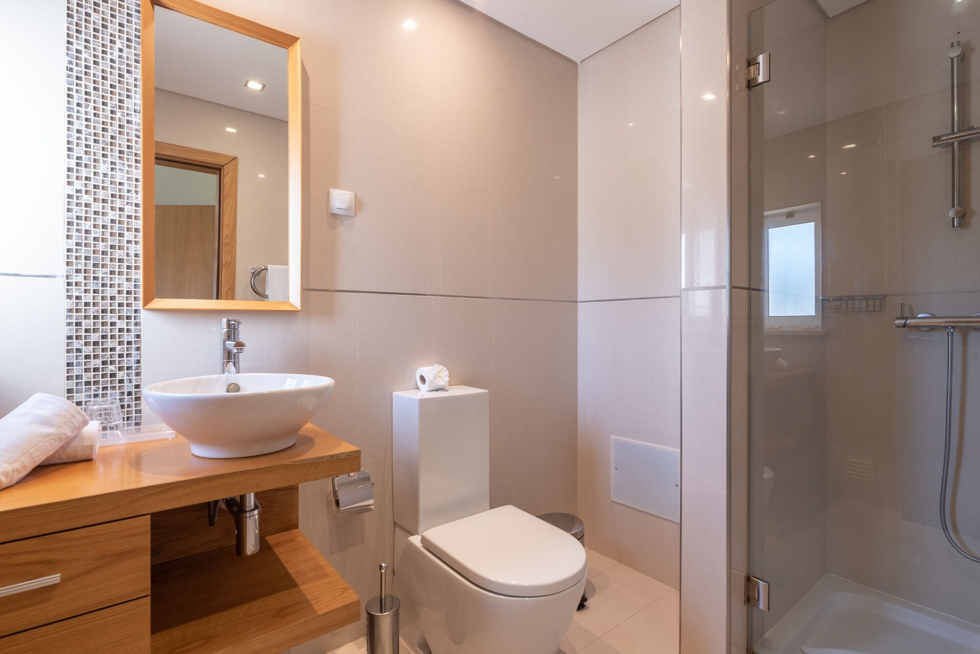 combined shower/bathtub, rainfall showerhead, designer toiletries