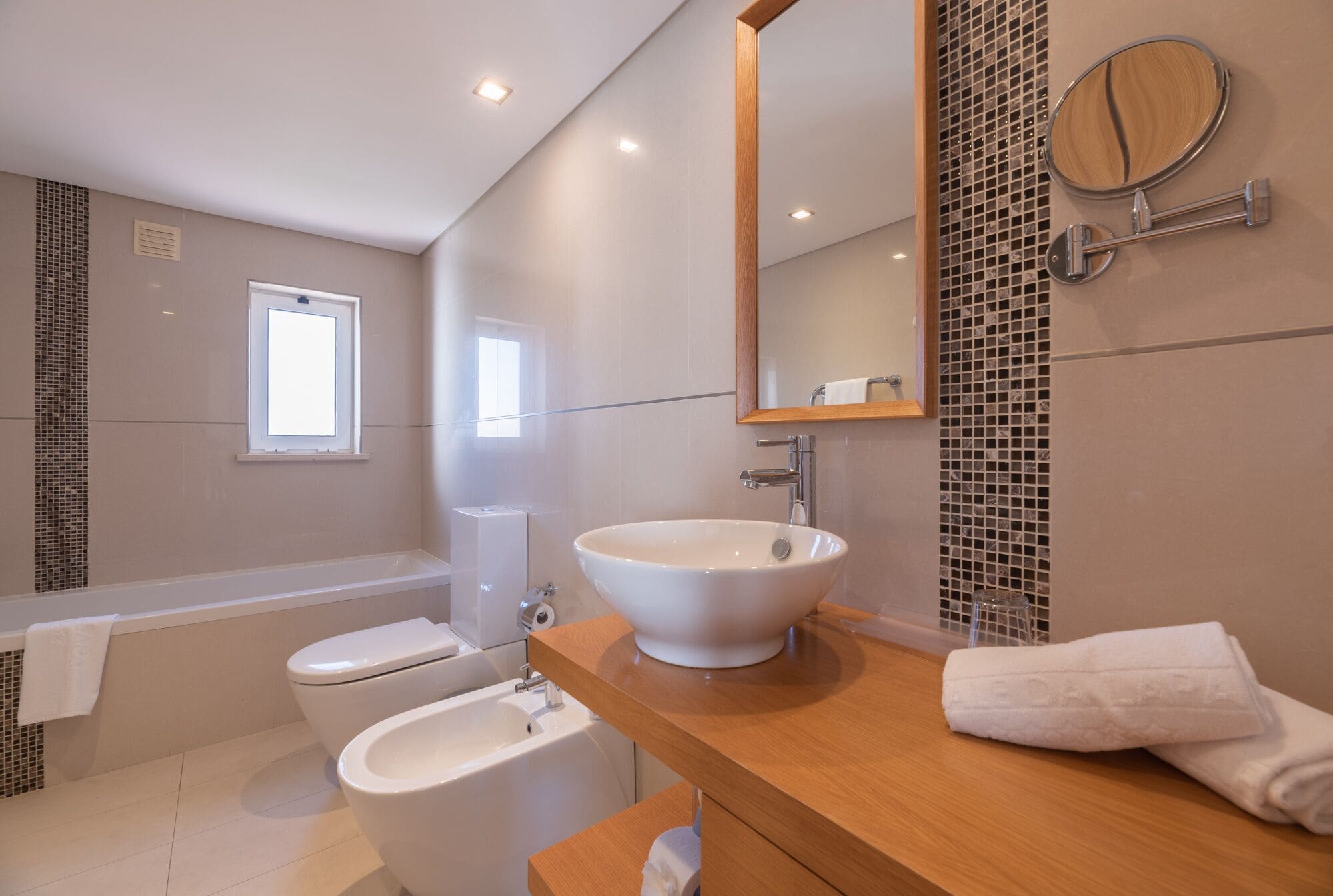 combined shower/bathtub, rainfall showerhead, designer toiletries