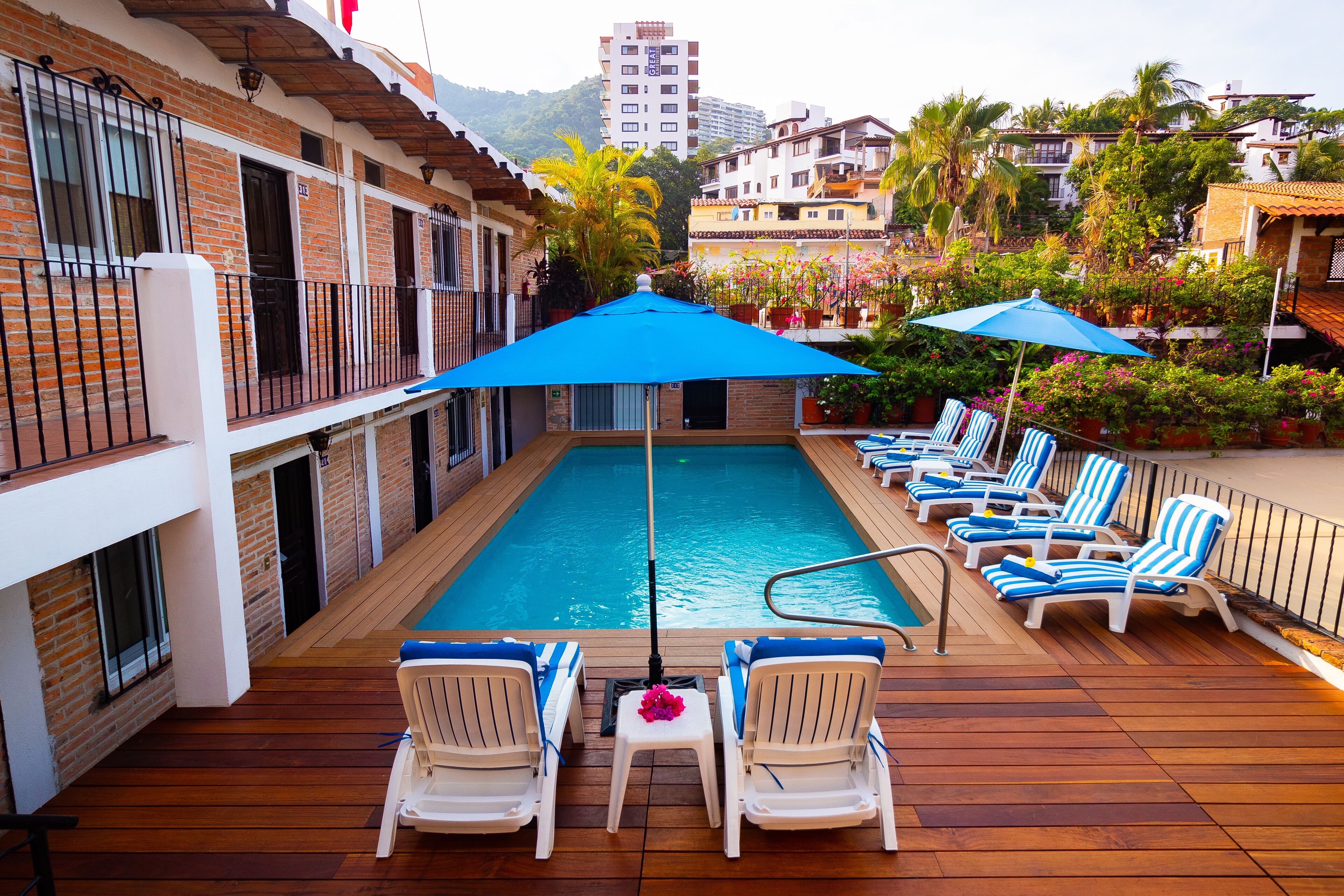 outdoor pool, pool umbrellas, pool loungers