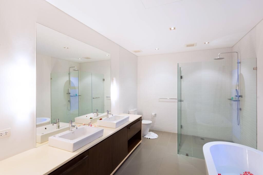 Separate bathtub and shower, hair dryer, towels