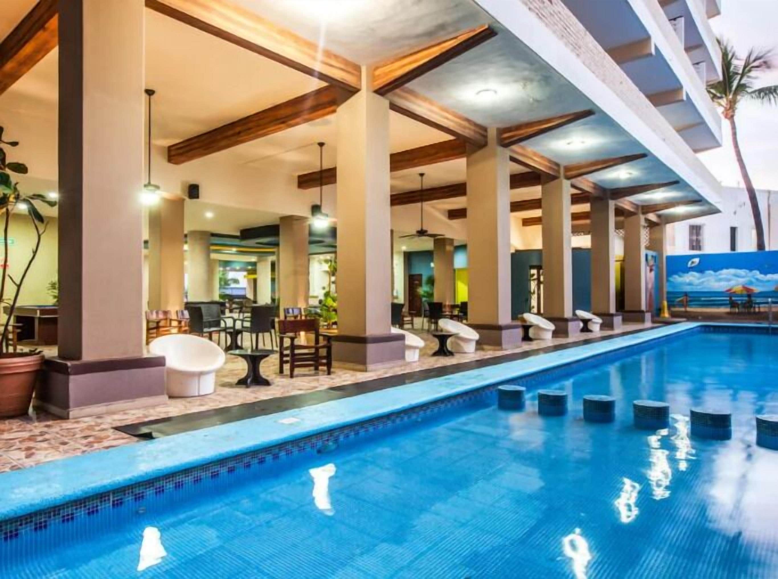 Outdoor pool, open 10:00 AM to 8:00 PM, pool loungers