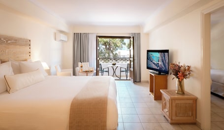 Family Suite | Premium bedding, minibar, in-room safe, desk. Canvas by Mitsis Petit Palais