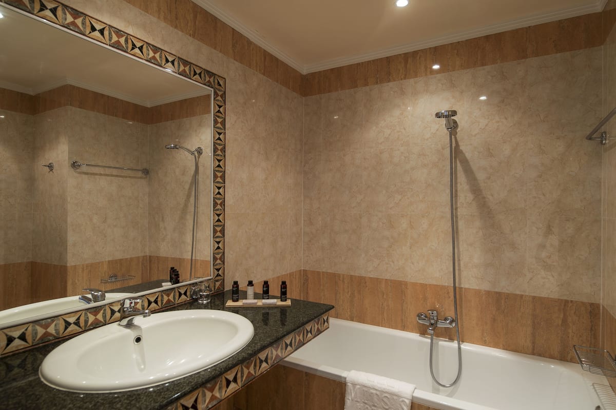 Bathtub, free toiletries, hair dryer, bathrobes