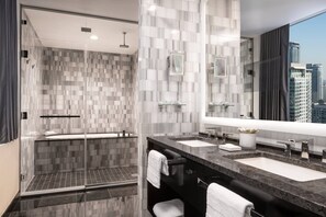 Separate tub and shower, designer toiletries, hair dryer, bathrobes