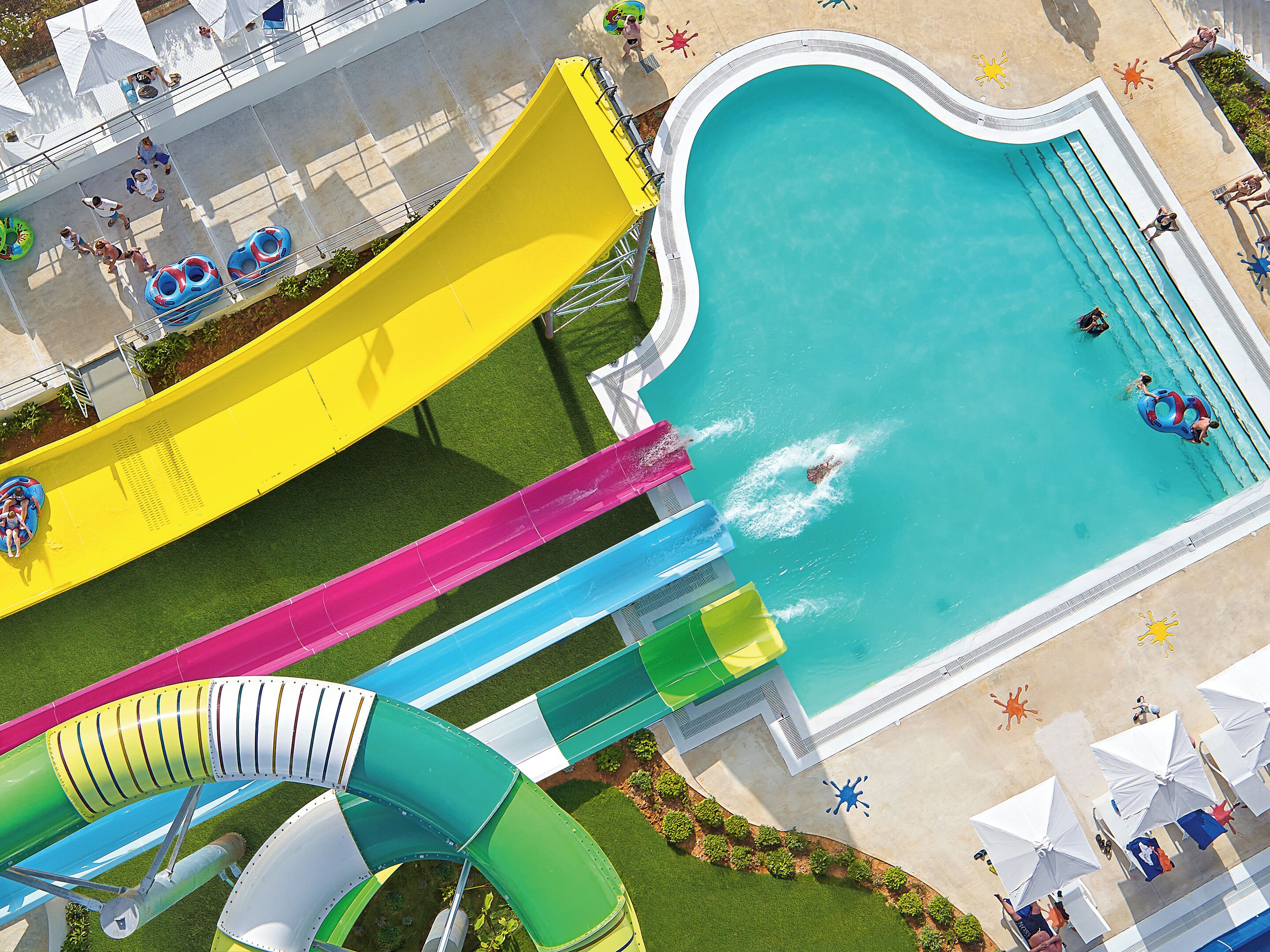 A water park with multiple slides and a pool.