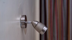 A door handle with a metallic finish and a label indicating a 3/4 inch diameter. - Hotel Ambassadeur (Nairobi)