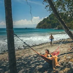 On the beach, black sand, free beach shuttle, sun loungers