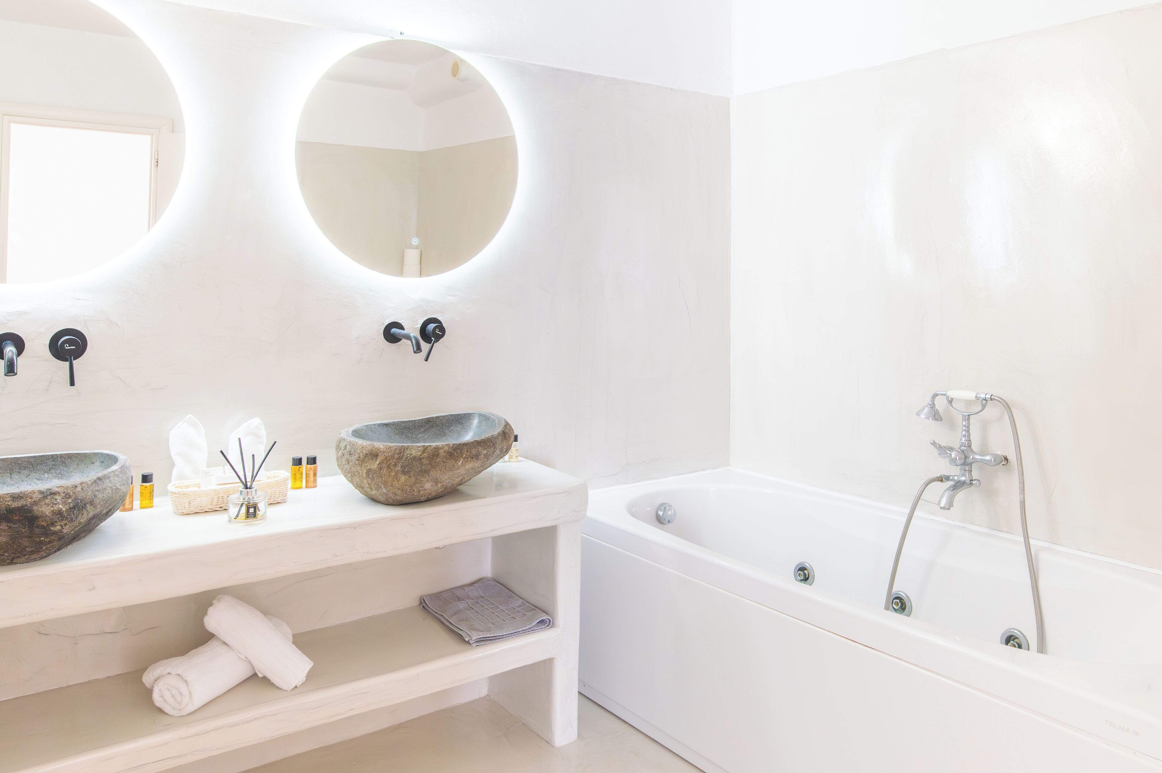 honeymoon suite, private pool, caldera view | bathroom | spring water bathtub, hydromassage showerhead, free toiletries