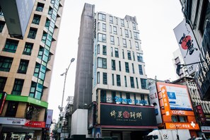 A multi-story building with various signs, including one for 'Just Sleep' and another for 'COSMED'. - Just Sleep Taipei Linsen (Taipei)