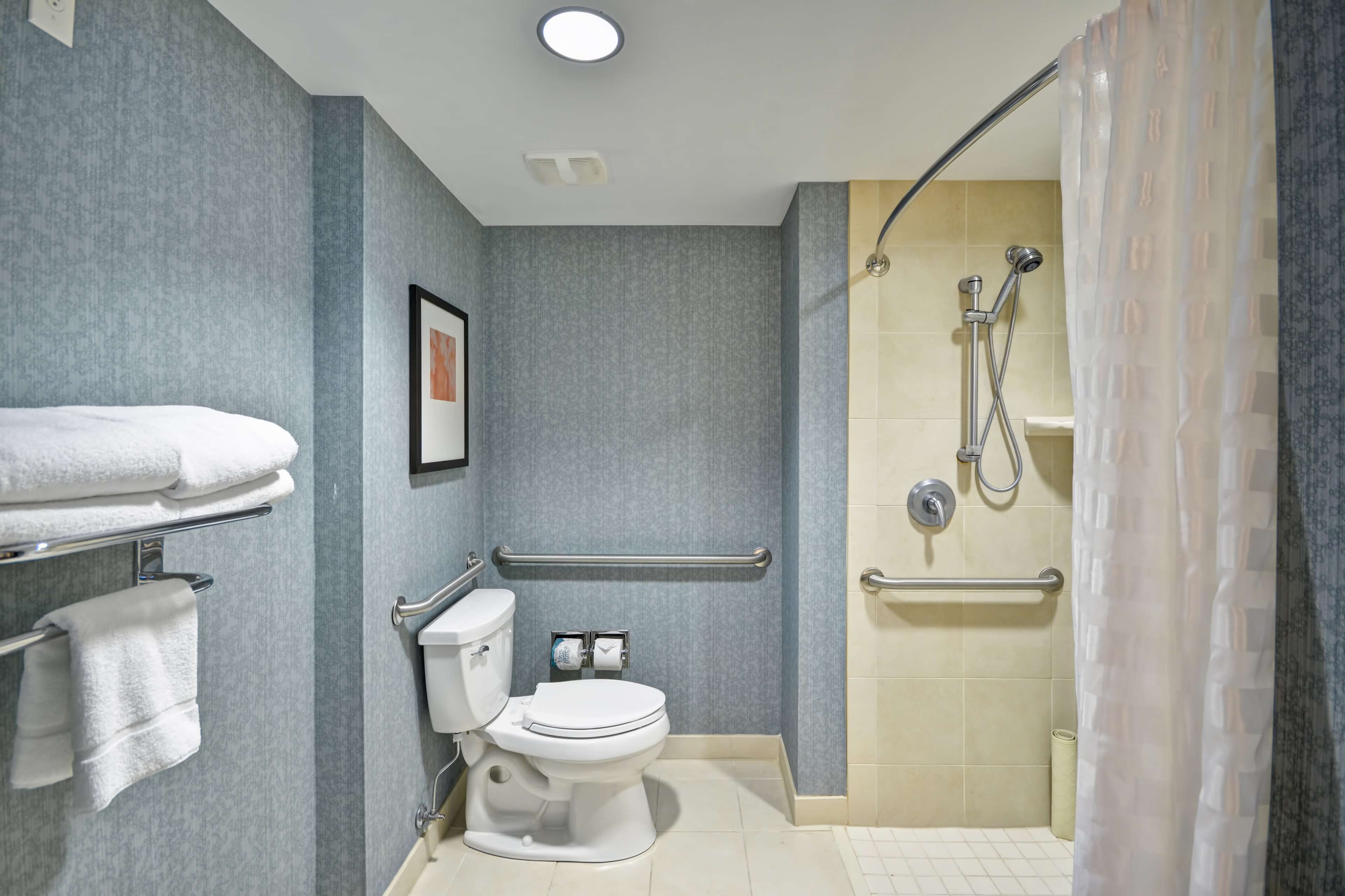 designer toiletries, hair dryer, towels