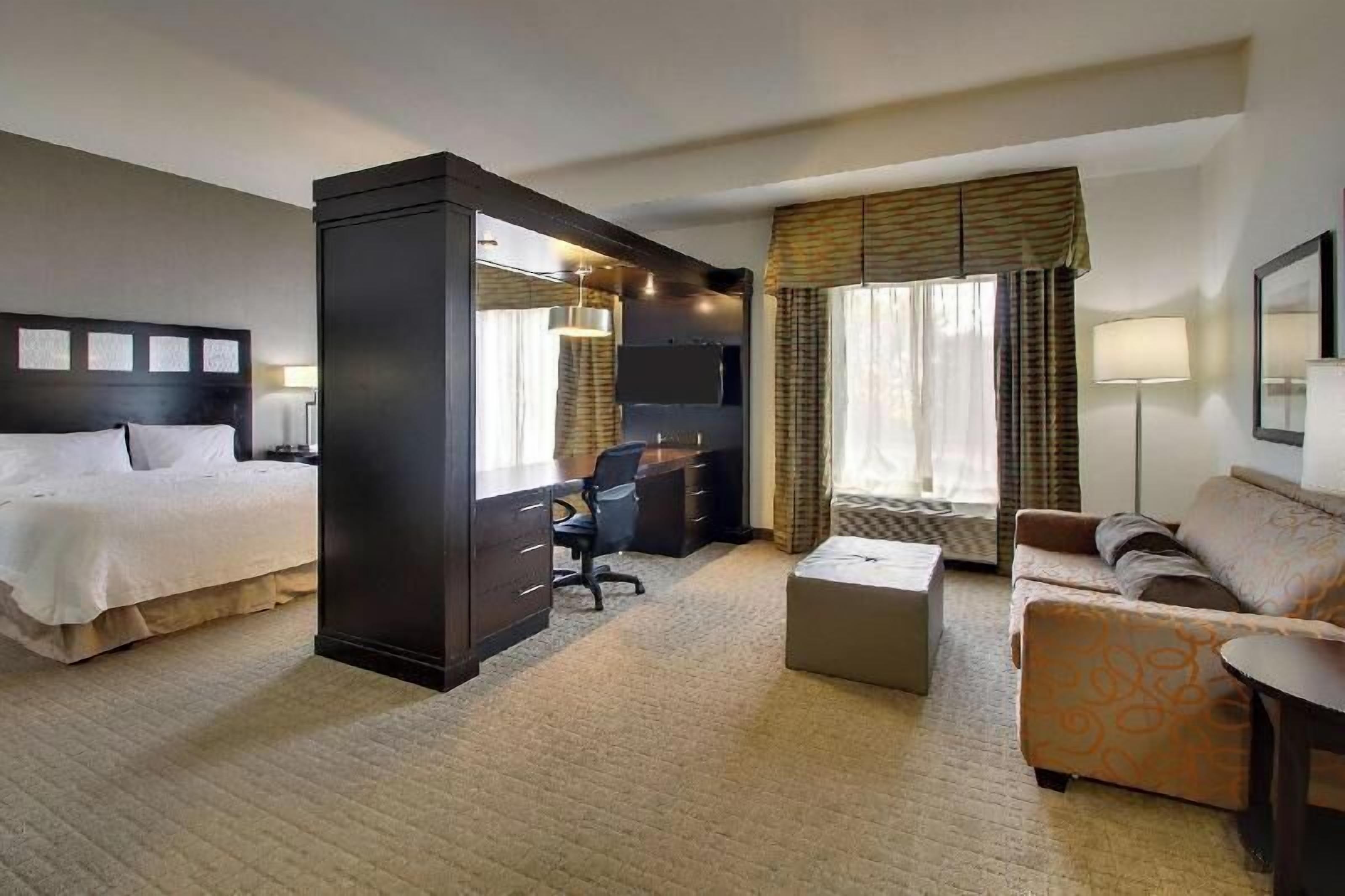 Desk, laptop workspace, blackout drapes, iron/ironing board