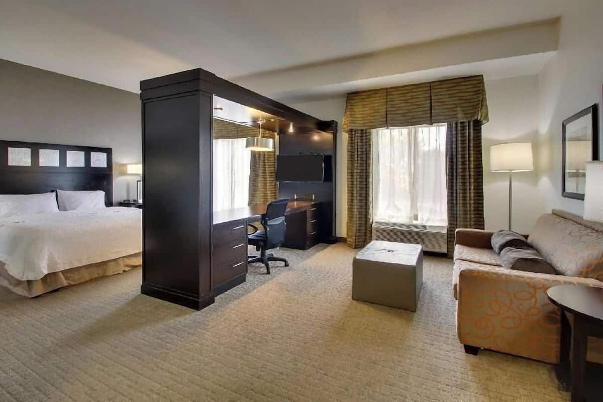 Desk, laptop workspace, blackout drapes, iron/ironing board