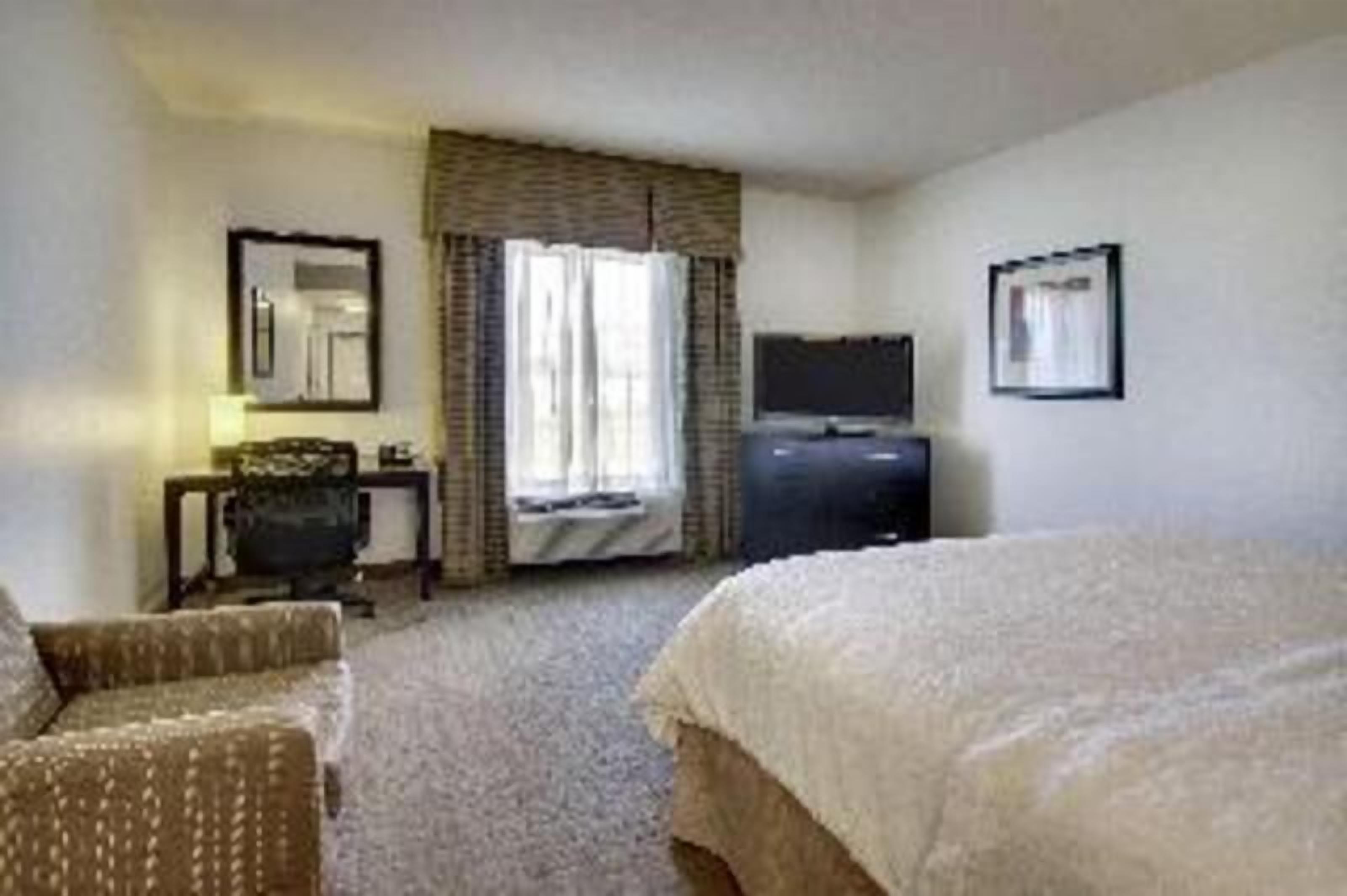 Desk, laptop workspace, blackout drapes, iron/ironing board