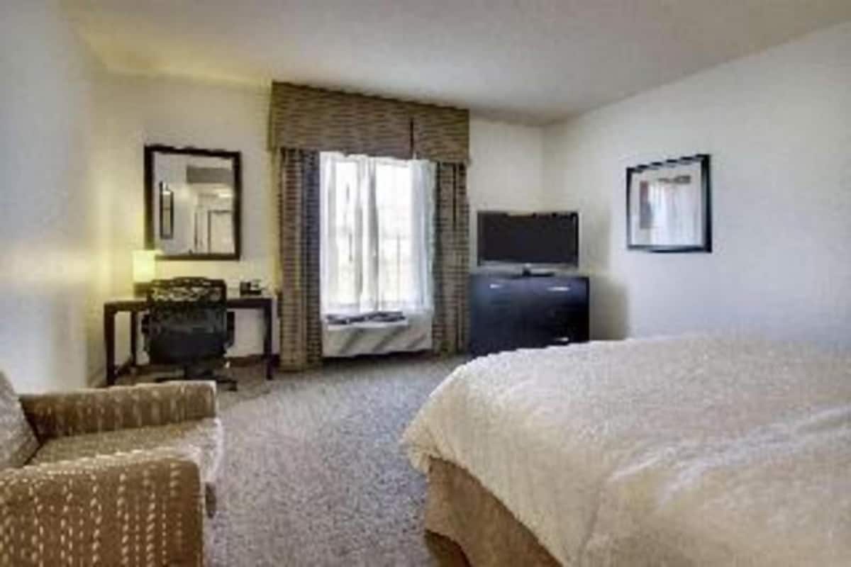 Desk, laptop workspace, blackout drapes, iron/ironing board
