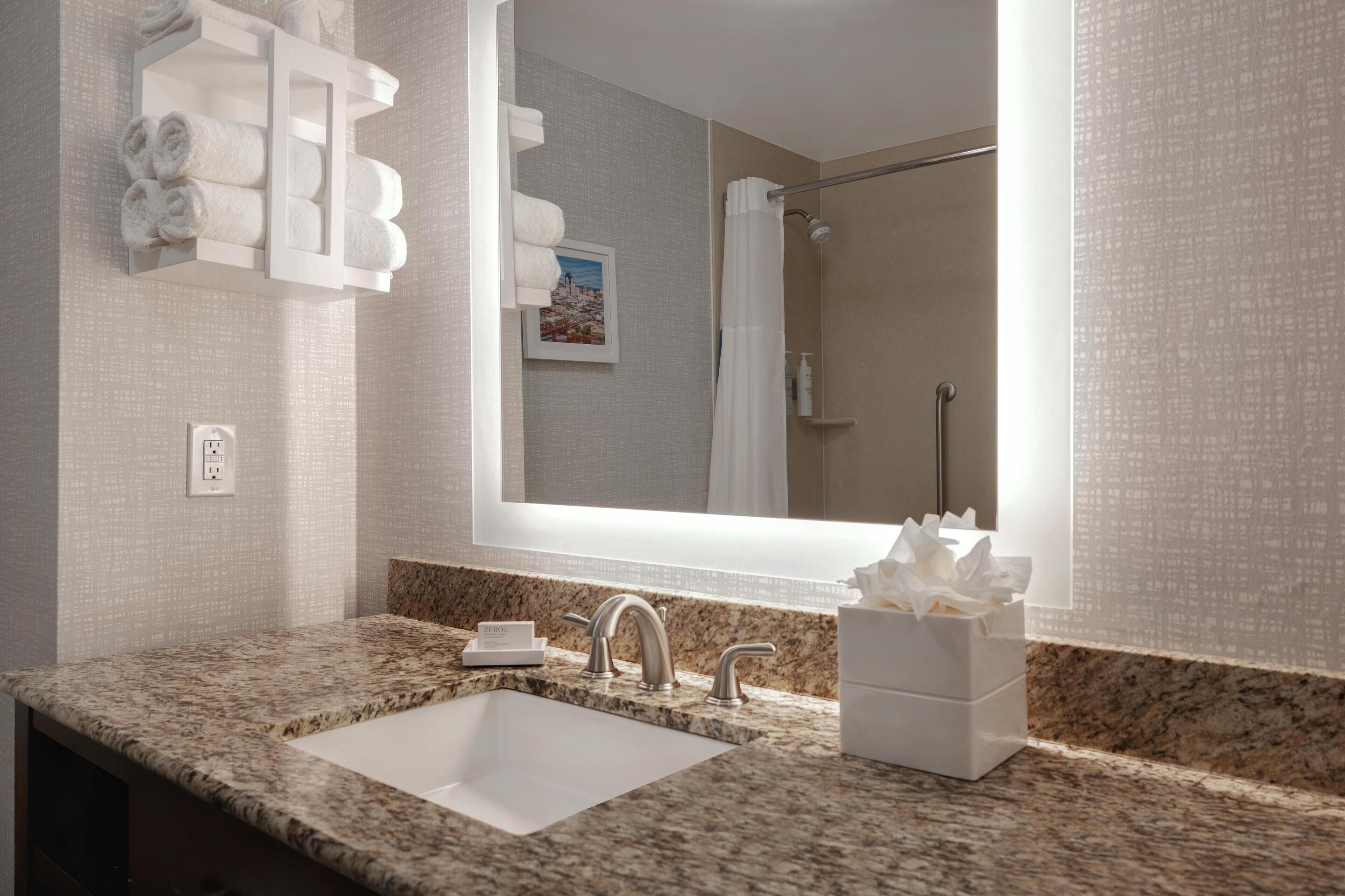 combined shower/bathtub, eco-friendly toiletries, hair dryer, towels