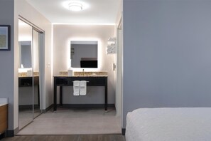 Desk, laptop workspace, blackout drapes, iron/ironing board