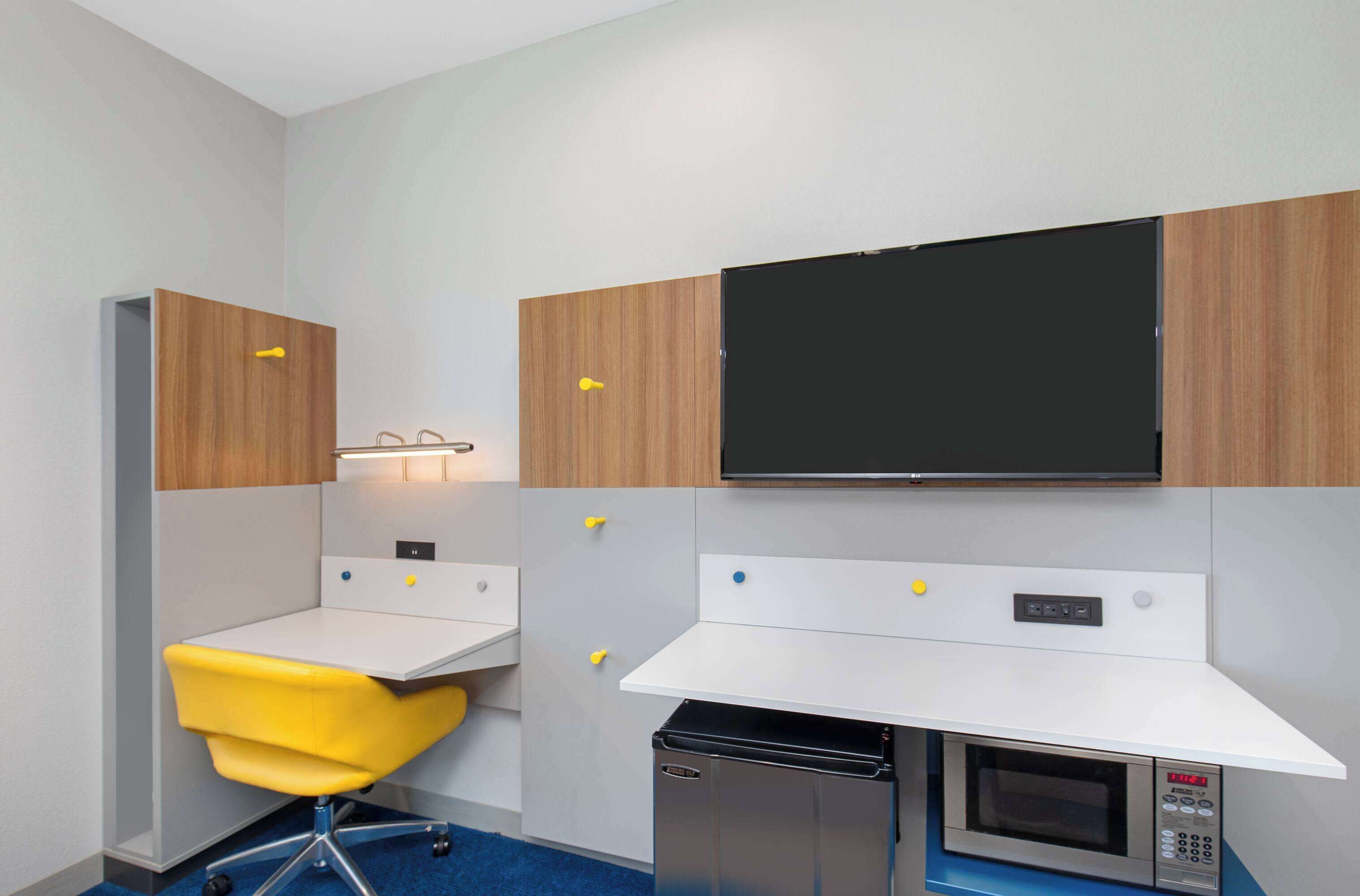 premium bedding, desk, blackout curtains, iron/ironing board