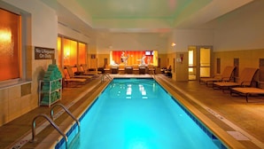 A swimming pool with lounge chairs, a lifeguard stand, and a sign indicating no lifeguard on duty. - Residence Inn by Marriott Pittsburgh North Shore (Pittsburgh)