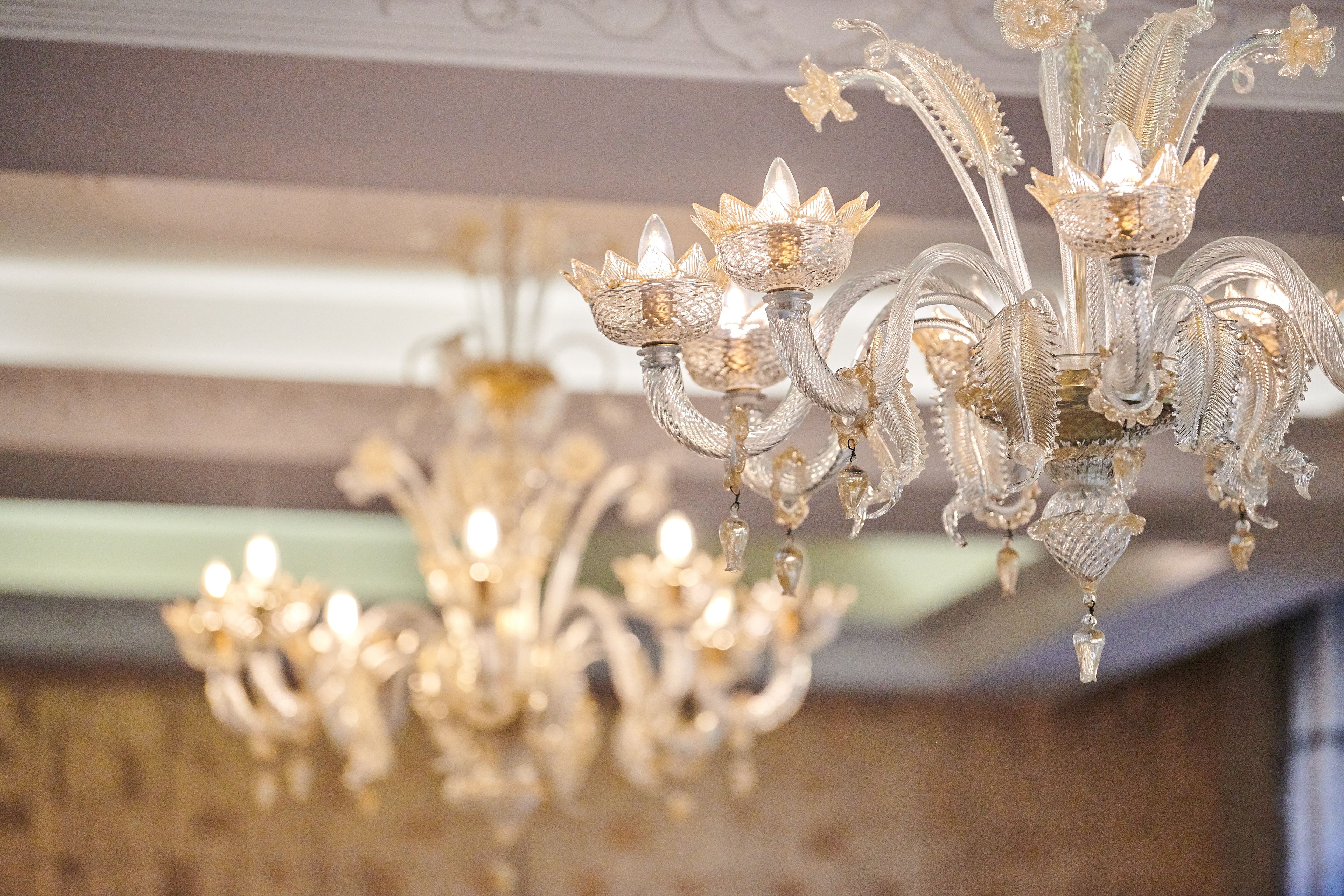 A chandelier with multiple arms and crystal details.