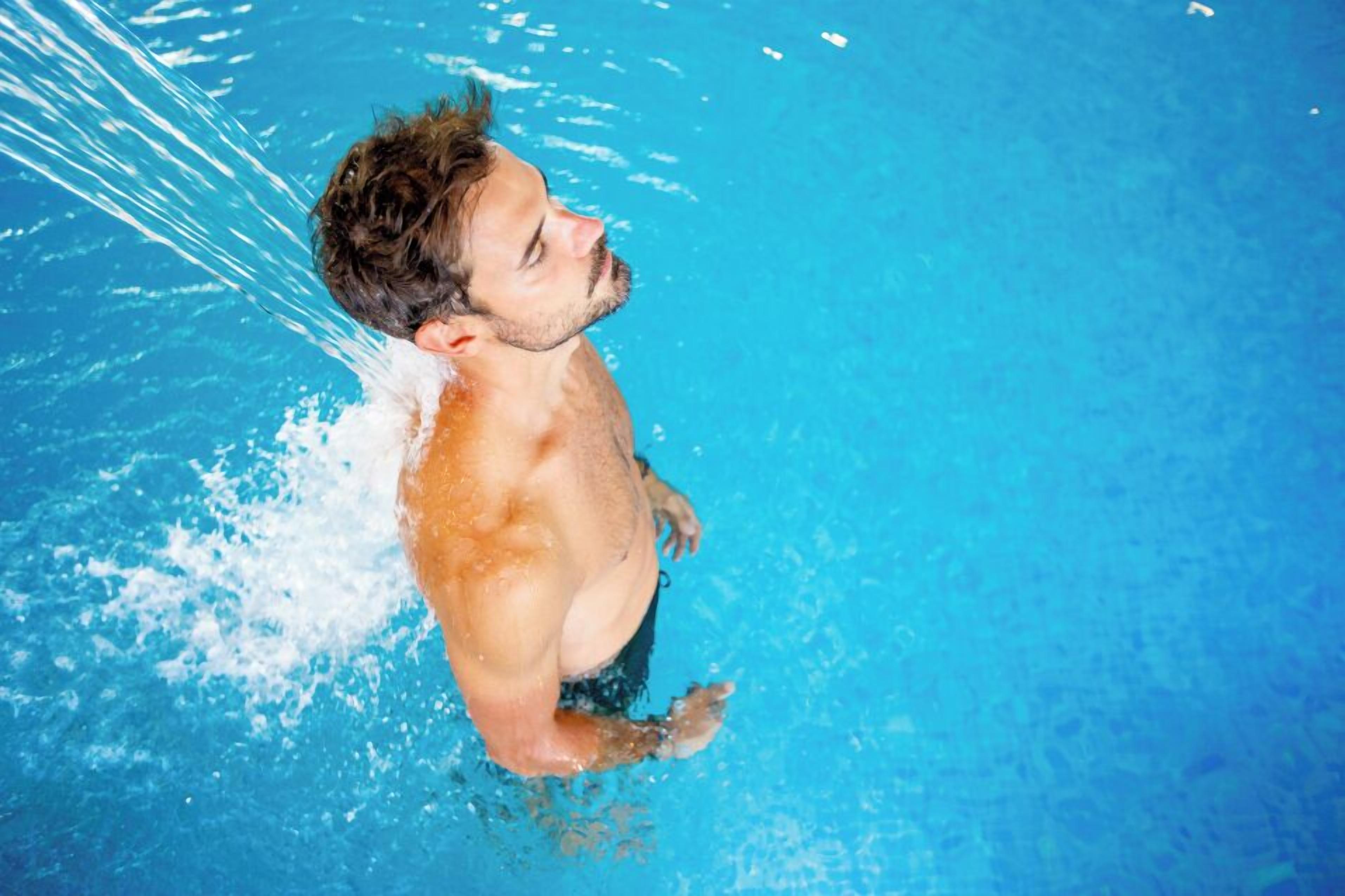 A person swimming in a pool.