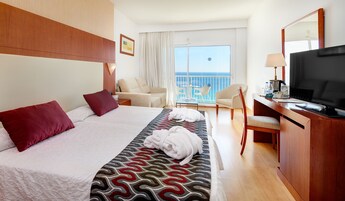 Ropa de cama de alta calidad, minibar, escritorio