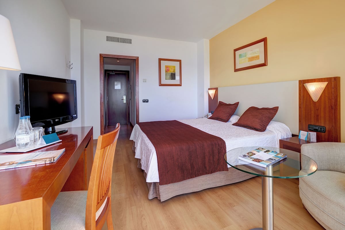 Ropa de cama de alta calidad, minibar, escritorio y insonorización