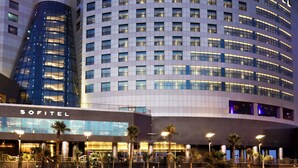 A modern hotel with a curved facade, multiple floors, and a prominent 'SOFITEL' sign. - Sofitel Al Khobar The Corniche (Al Khobar)