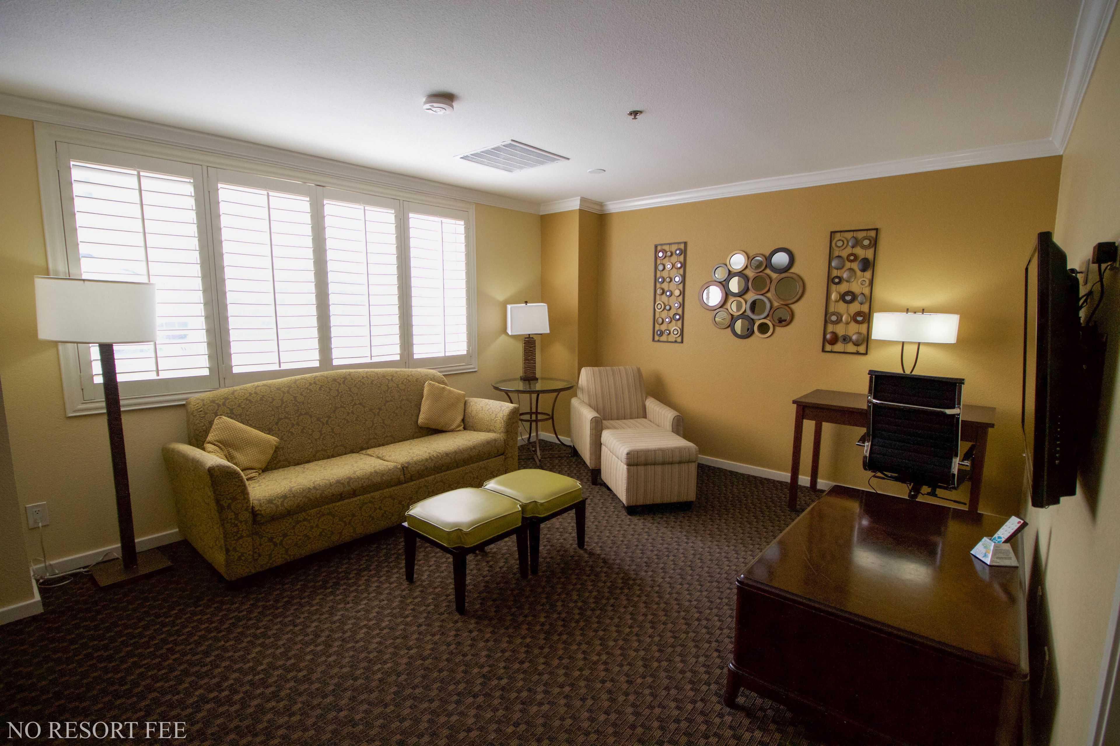 suite, 1 king bed, non smoking, refrigerator (no resort fees) | living area | 42-inch lcd tv with cable channels, tv, mp3 dock