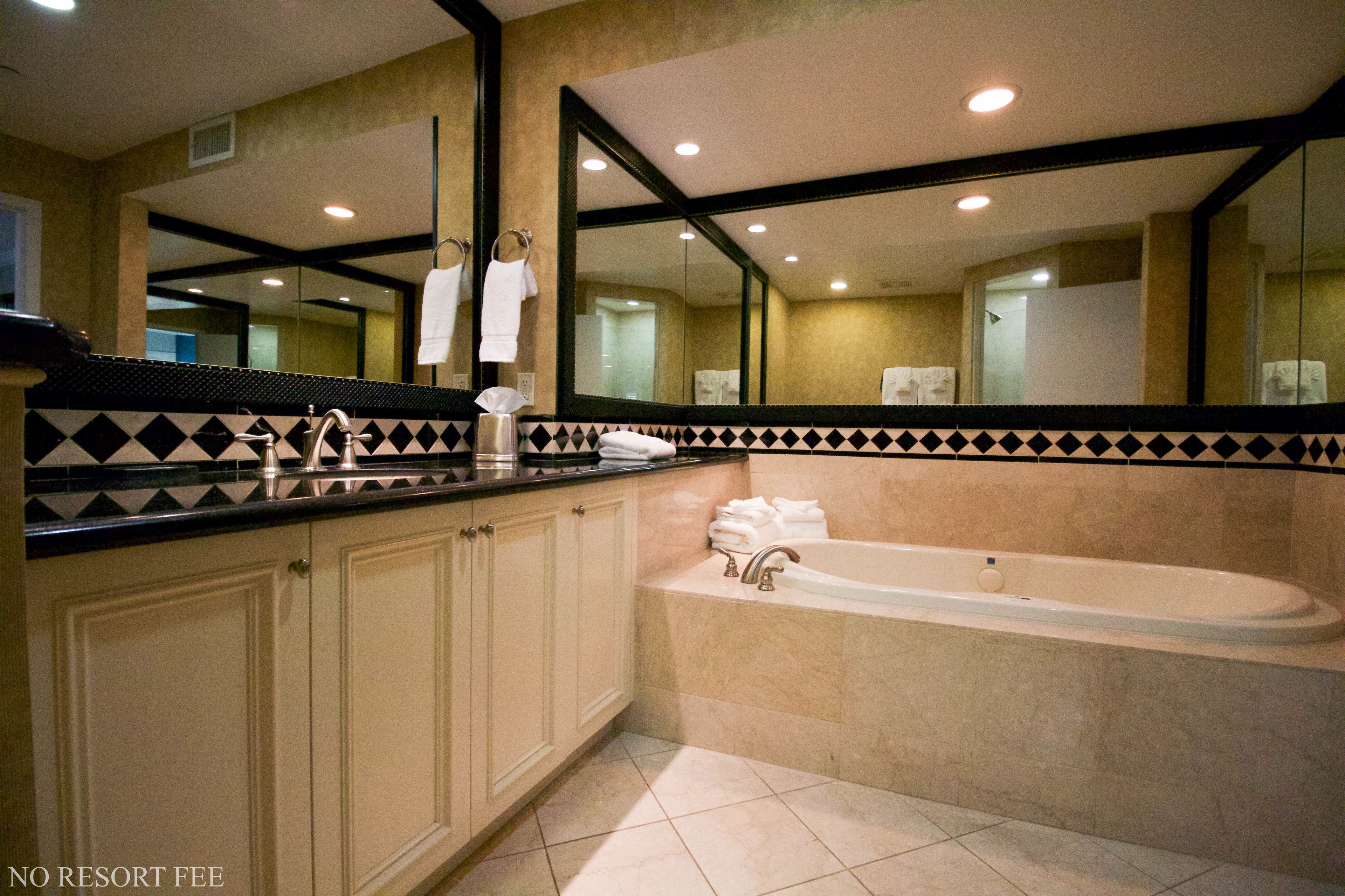 suite, 1 king bed, non smoking, jetted tub (no resort fees) | bathroom | free toiletries, hair dryer, towels, soap