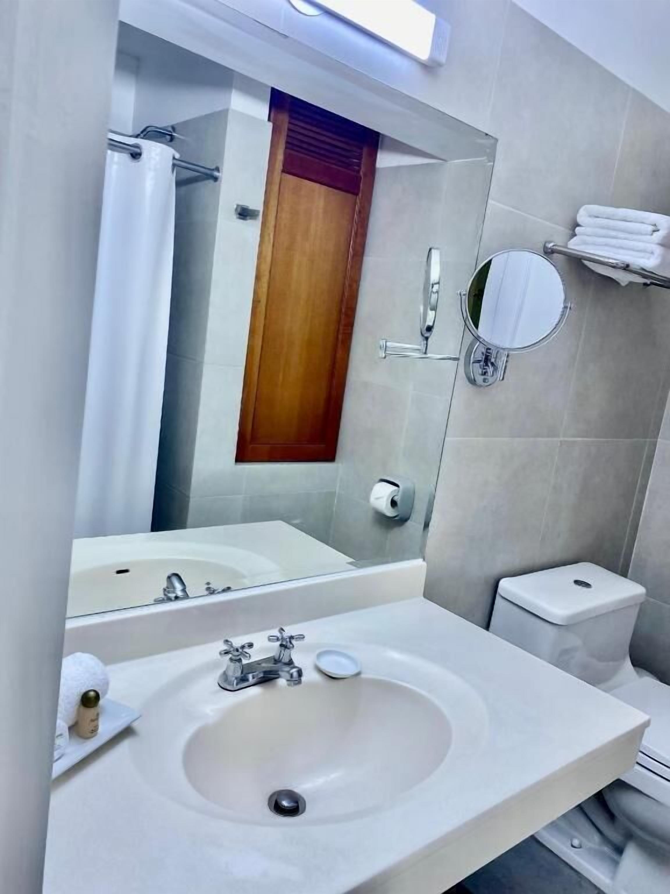 deluxe double room with extra bed | bathroom | shower, hair dryer, towels