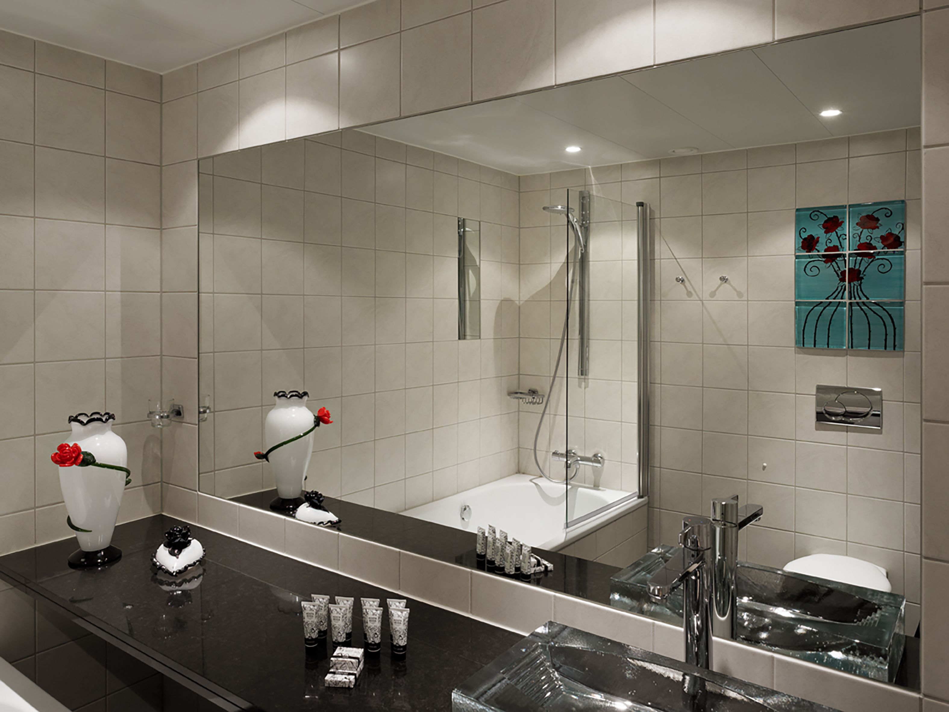 executive studio suite | bathroom | designer toiletries, hair dryer, bathrobes, slippers