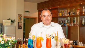 A bar area with a variety of drinks and bottles. - Palm Beach (Varna)