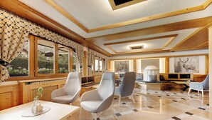 A spacious room with a checkered floor, wooden beams, and large windows with curtains. - Aparthotel Majestic (Predazzo)