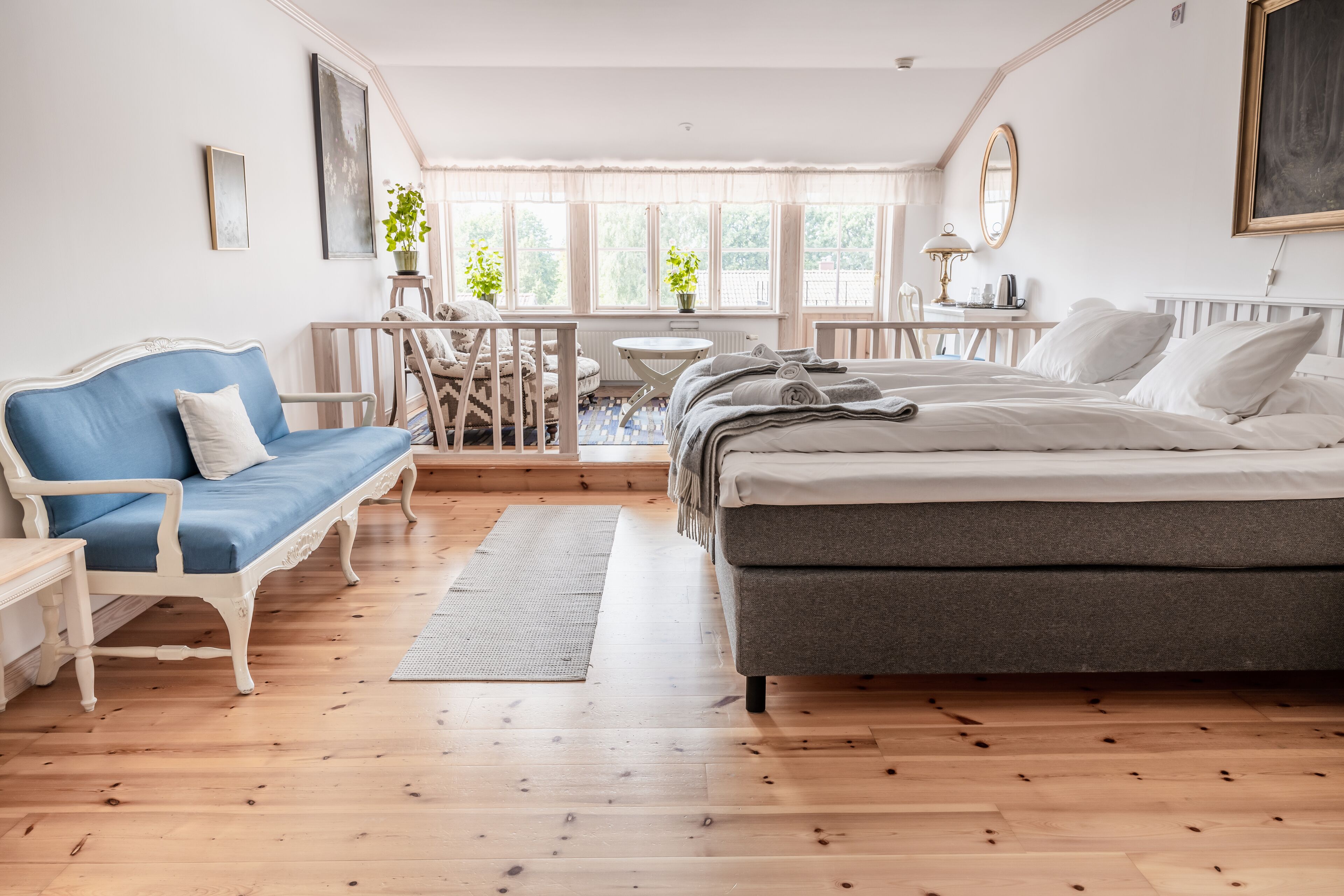 suite, lake view | living area | flat-screen tv