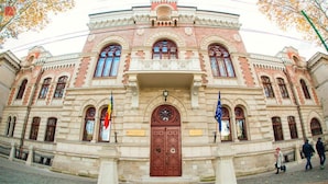 A historic building with a symmetrical facade, large central doors, and arched windows. - Mercure Chisinau Center Jazz Hotel (Chisinau)