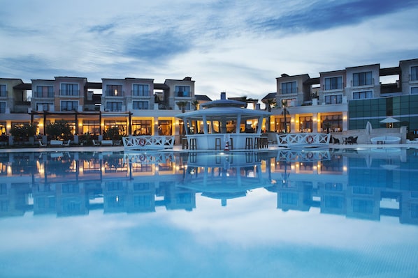 Indoor pool, seasonal outdoor pool, pool umbrellas, pool loungers
