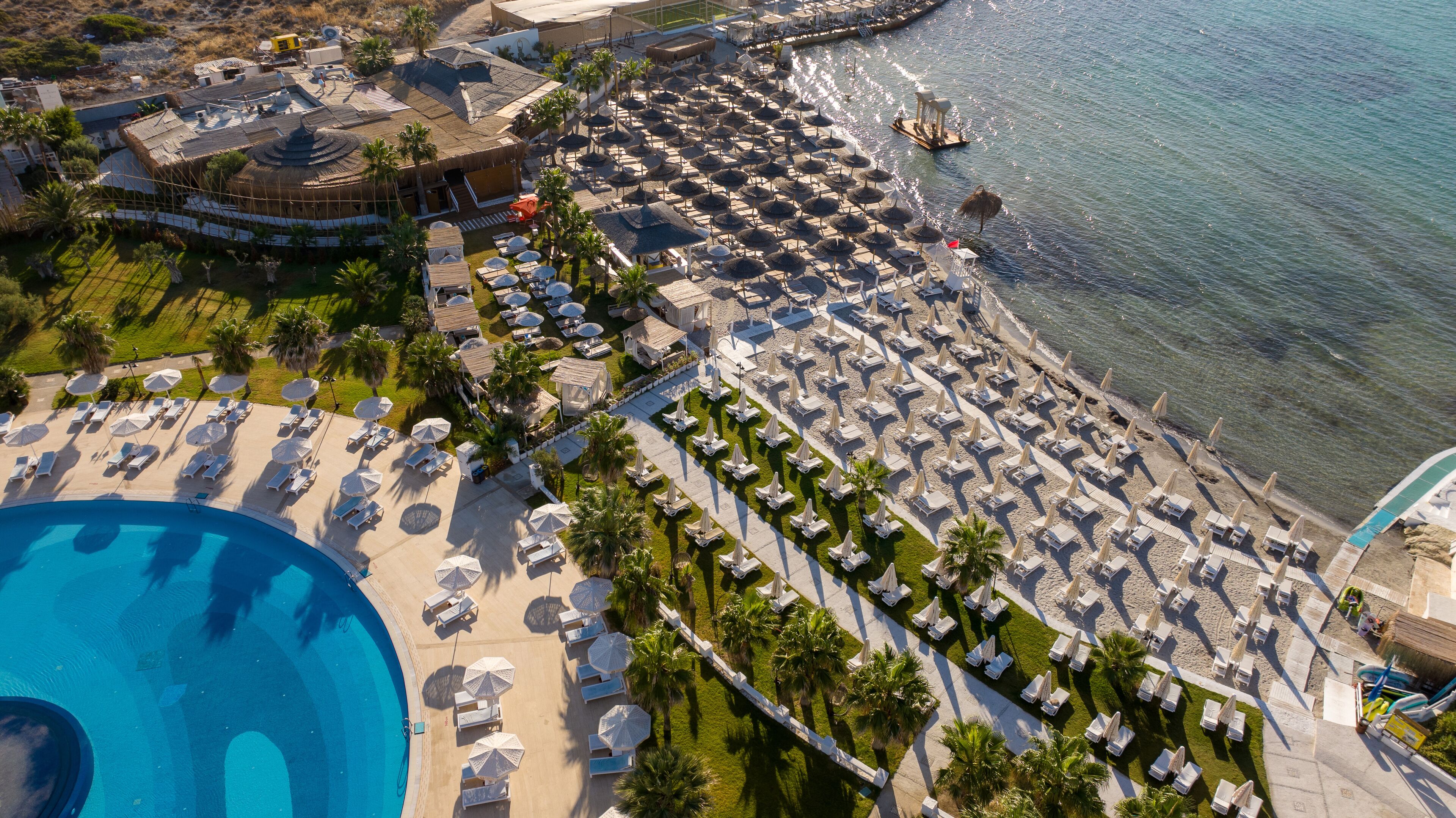 Private beach, white sand, sun loungers, beach umbrellas