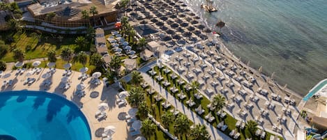 Private beach, white sand, sun loungers, beach umbrellas