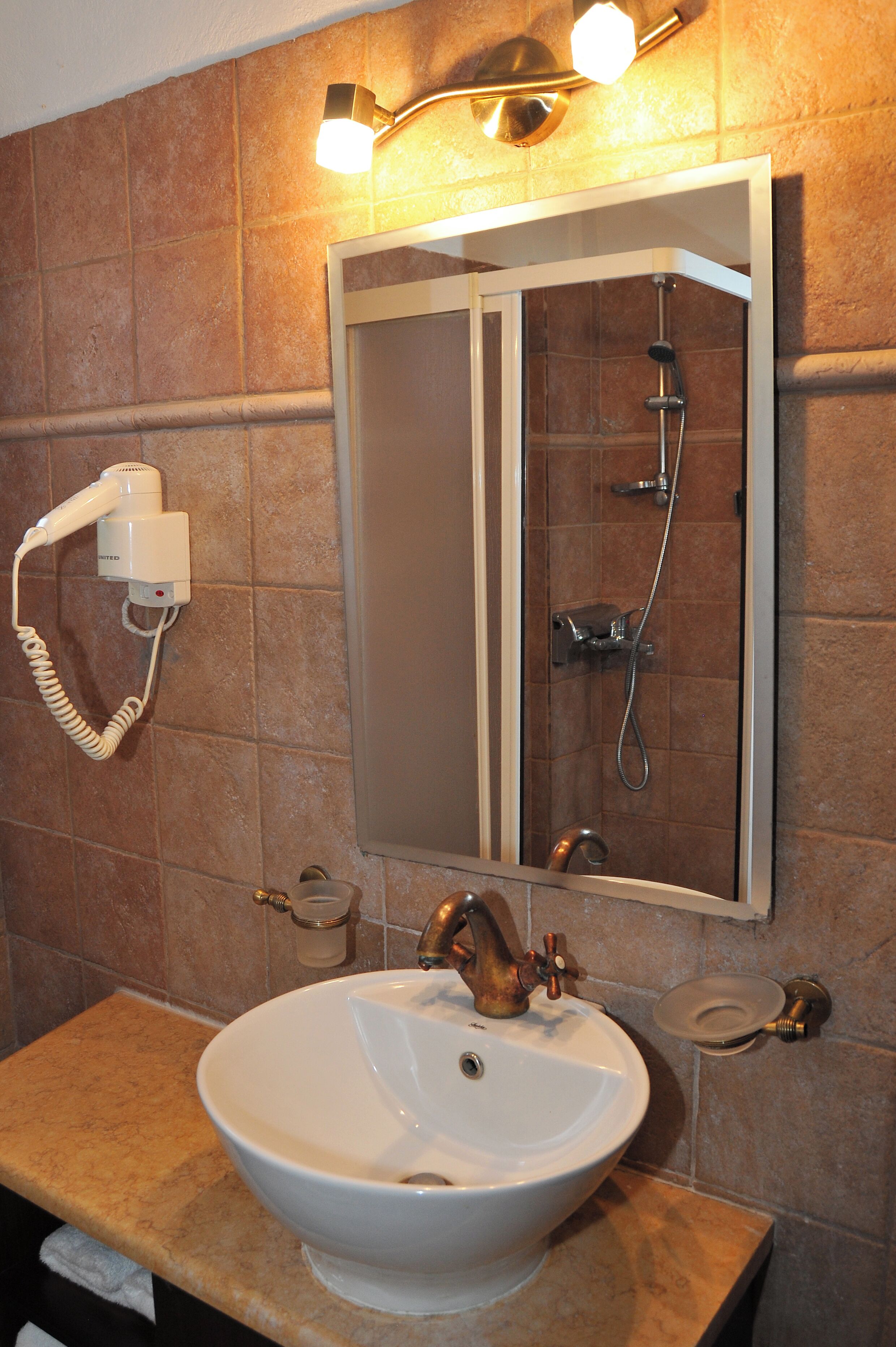 deluxe apartment, 1 queen bed with sofa bed | bathroom | hair dryer, slippers, towels