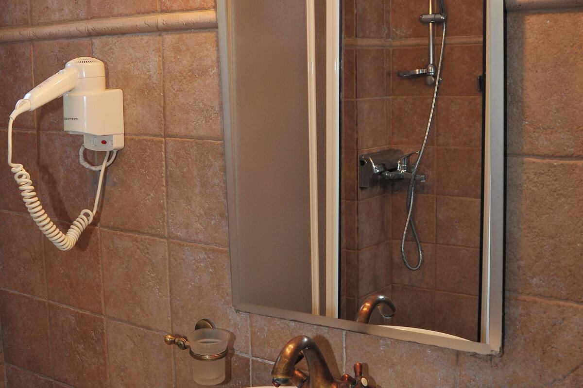 deluxe apartment, 1 queen bed with sofa bed | bathroom | hair dryer, slippers, towels