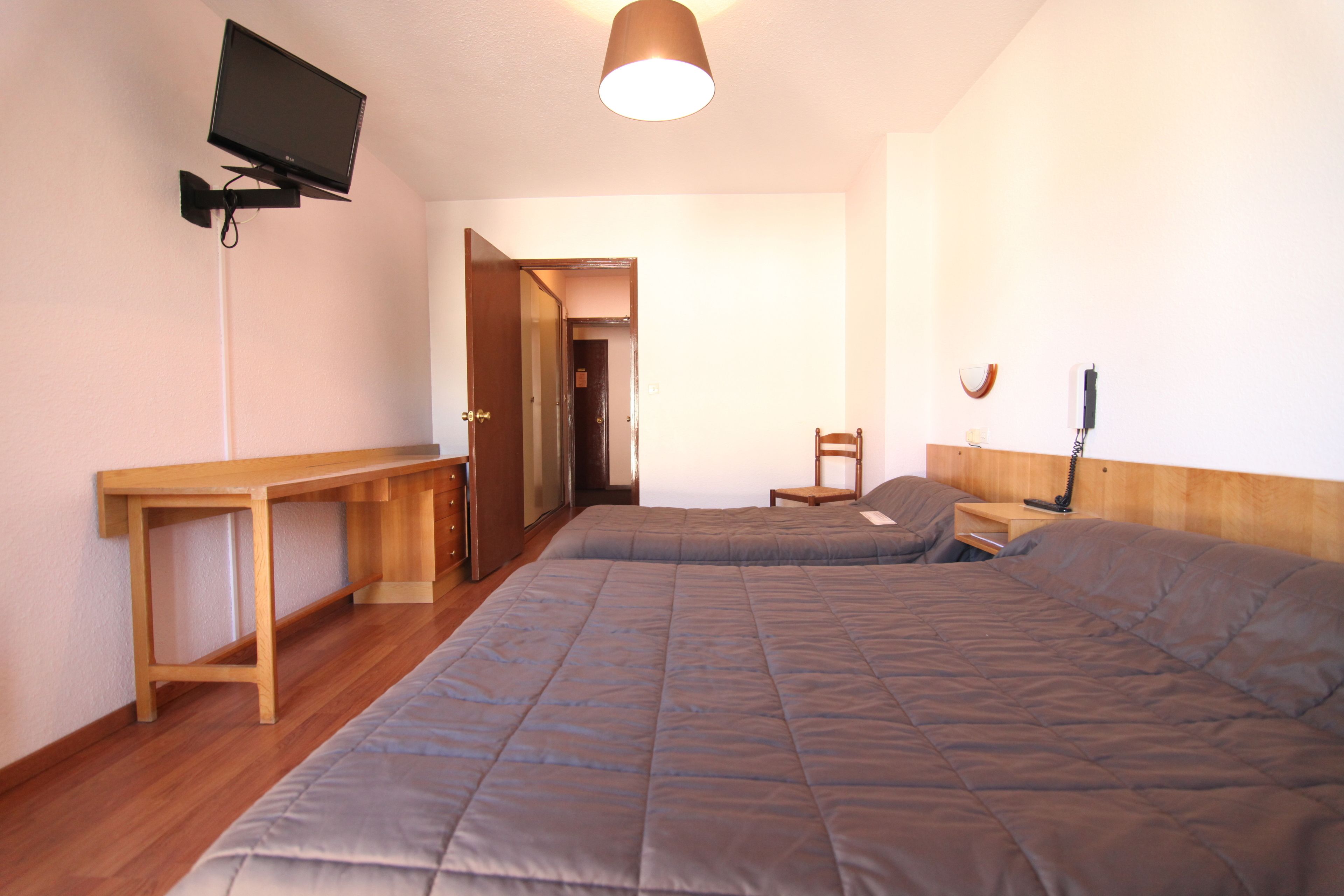 traditional triple room | desk, blackout curtains, soundproofing, iron/ironing board