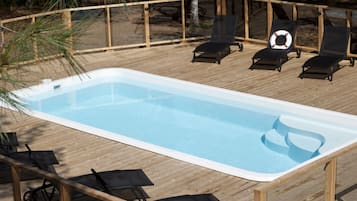 Seasonal outdoor pool, pool loungers
