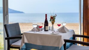 A table set for two with a view of the sea. - Happy Days Hotel (Apokoronas)