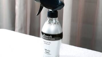 A bottle of Reeshe brand deodorant power spray.