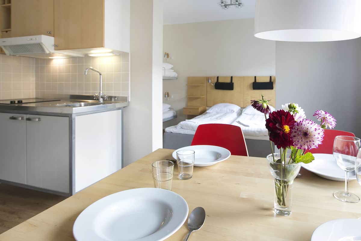 A modern kitchen with a dining area.